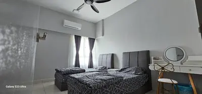 a bedroom with two beds and a ceiling fan at IPOH Town R&E Homestay in Ipoh