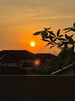 a sunset with the sun setting in the background at YK Sweet home sungai petani 1 @ 16 people above in Sungai Petani