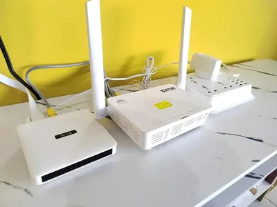 two white devices sitting on a table with a counter top at Seaview Infinity Pool , 40th , 9pax, 3Rooms 2Carpark in Jelutong
