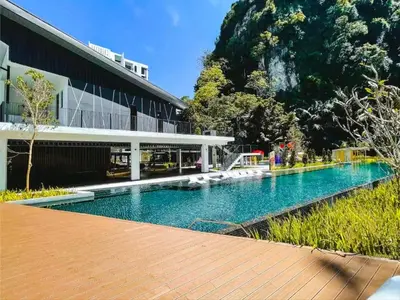 a swimming pool in front of a building at Ipoh Cove Hillview Suite 7-8 pax Tambun Lost World by City Home Empire in Ipoh