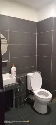 a bathroom with a toilet and a sink at RJ STUDIO 2- Kompleks Mutiara in Gua Musang