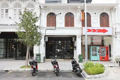 a group of motorcycles parked in front of a building at Dou Houz Georgetown in George Town