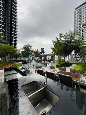 a kitchen counter with a sink in a city at Urban Suites Georgetown l SeaView & CityView l Family Stay in Jelutong