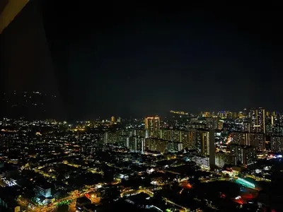 a view of a city at night at Urban Suites Georgetown l SeaView & CityView l Family Stay in Jelutong