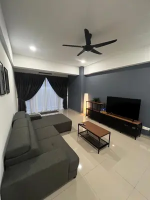a living room with a couch and a ceiling fan at Sense In Passionate in Sitiawan