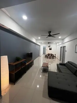 a living room with a couch and a ceiling fan at Sense In Passionate in Sitiawan