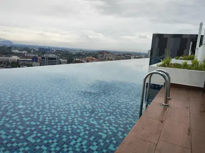 a swimming pool on the roof of a building at Decozy 8.0 IpohTownCondo (10pax) in Ipoh