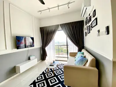 a living room with a couch and a window at Decozy 8.0 IpohTownCondo (10pax) in Ipoh