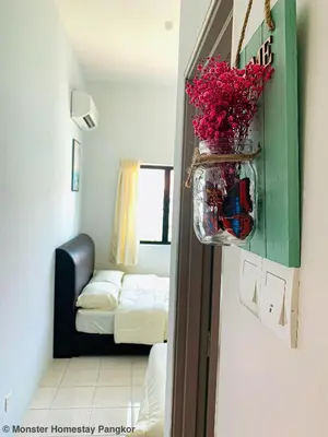 a room with a room with a room with a bed at Sunshine Lot 10 Pangkor in Kampong Sungai Udang