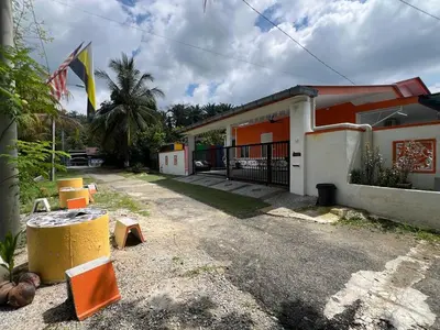 a house with a flag in front of it at Agro Village Stay in Tapah