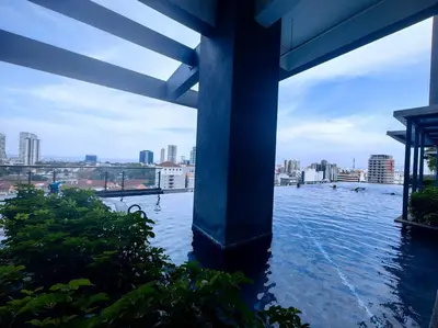 a bridge over water with a city in the background at LS Tropicana 218*Sea View*1BR*Georgetown*King Bed in George Town