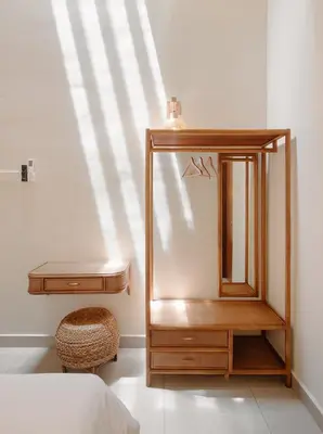 a bedroom with a dresser and a mirror at Mint Villa with Jacuzzi Pool in George Town