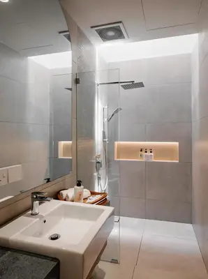 a bathroom with a sink and a shower at Mint Villa with Jacuzzi Pool in George Town