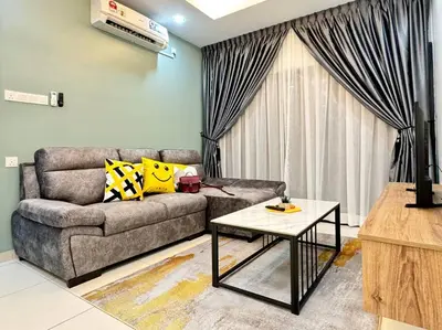 a living room with a couch and a table at Decozy7.0 Ipoh Town Condo(12pax) in Ipoh