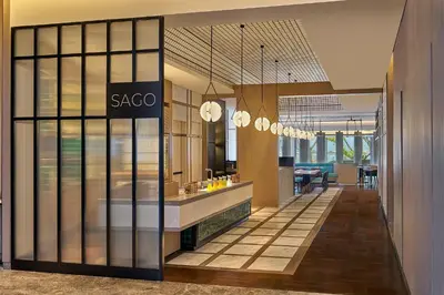 a lobby with a saccao sign on a glass wall at Marriott Executive Apartments Penang in George Town