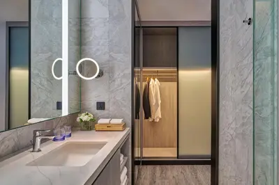a bathroom with a sink and a shower at Marriott Executive Apartments Penang in George Town