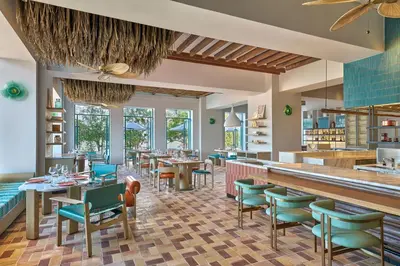 a restaurant with tables and chairs and a bar at Marriott Executive Apartments Penang in George Town