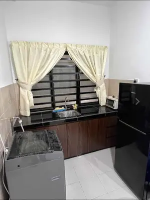 a small kitchen with a sink and a window at Pusing Kampung Affordable Homestay Astro in Pusing