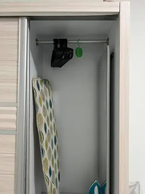 a door of a closet with a surfboard in it at Pusing Kampung Affordable Homestay Astro in Pusing