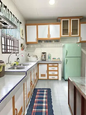 a kitchen with a green refrigerator and a sink at Cozy Modern Classic Home in Ipoh in Ipoh