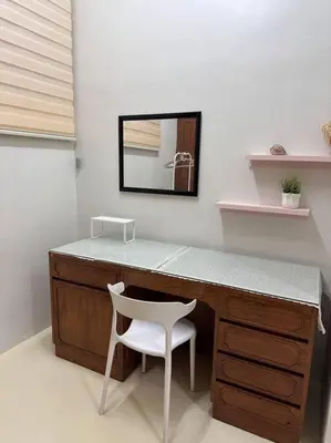 a desk with a white chair and a mirror at The Hidden 7 in Taiping