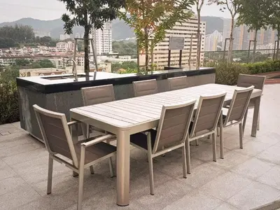 a white table and chairs on a balcony at Urban Suites 3 Rooms, Cat Theme & Romantic in Jelutong