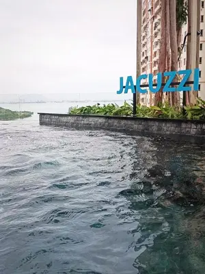a large body of water next to a large building at Romantic Sea View Room @ Urban Suites, Jelutong in Jelutong