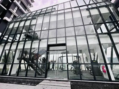 a large glass building with an open door at 2BR OR 3BR Wonderful Homestay at Urban Suite BY LJ PULSE in Jelutong