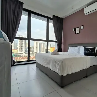 a bedroom with a large bed and a large window at 2BR OR 3BR Wonderful Homestay at Urban Suite BY LJ PULSE in Jelutong