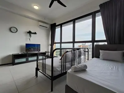 a bedroom with a bed and a large window at 2BR OR 3BR Wonderful Homestay at Urban Suite BY LJ PULSE in Jelutong