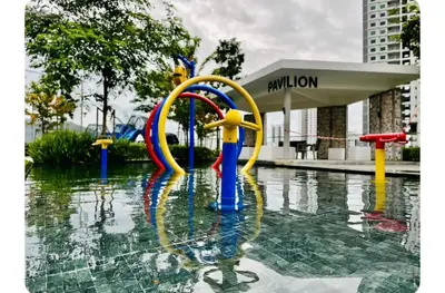 a fountain in a pool of water in a city at 2BR OR 3BR Wonderful Homestay at Urban Suite BY LJ PULSE in Jelutong