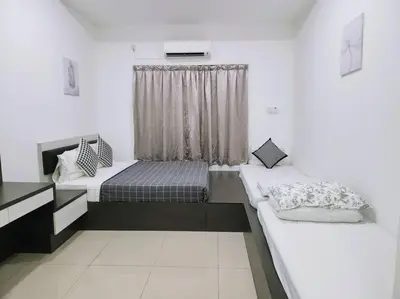 a room with two beds and a window at Tambun lost world luxury villa 5BR/20 pax/mahjong/karaok/bbq/garden events in Tambun