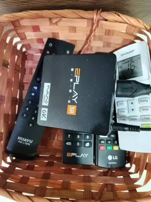 a bunch of remote controls in a wicker basket at IPOH BOTANI bauhaus 17pax/4BR/mahjong/tv box in Ipoh
