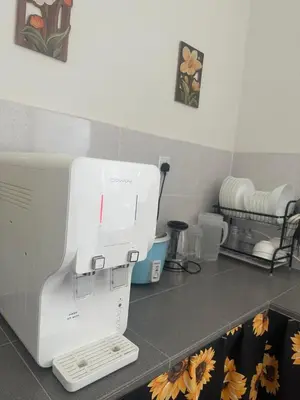 a sewing machine sitting on a counter in a kitchen at Pantai Remis Bear Homestay in Pantai Remis