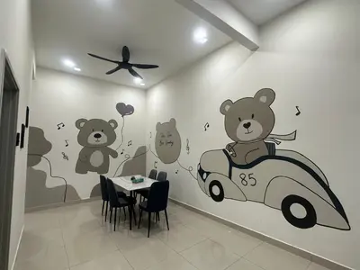 a dining room with teddy bears and a car on the wall at Pantai Remis Bear Homestay in Pantai Remis