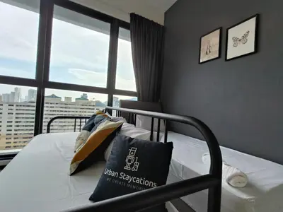 a bedroom with a bed with a large window at New Urban Suite Majestics 3BR Homestay at Georgetown BY URBAN STAYCATION LOD PULSE in Jelutong