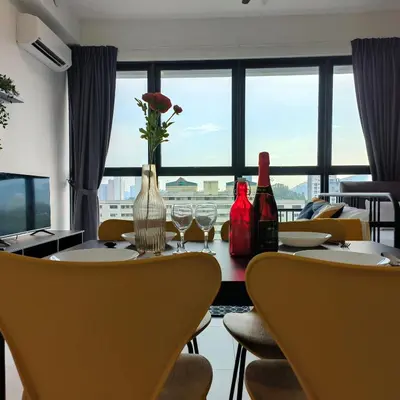 a dining room with a table with chairs and a window at New Urban Suite Majestics 3BR Homestay at Georgetown BY URBAN STAYCATION LOD PULSE in Jelutong