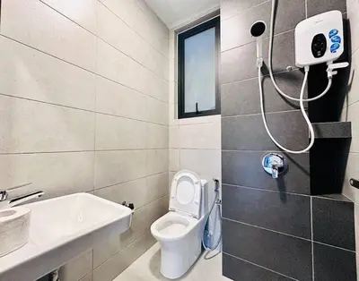 a bathroom with a toilet and a sink at New Urban Suite Majestics 3BR Homestay at Georgetown BY URBAN STAYCATION LOD PULSE in Jelutong