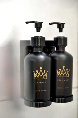 two bottles of soap sitting next to each other at The Leith in George Town