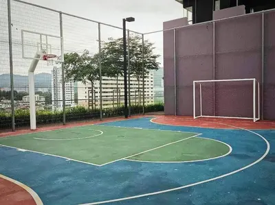 an indoor basketball court with a net on a building at Romantic Sea View @ Urban Suite in Jelutong