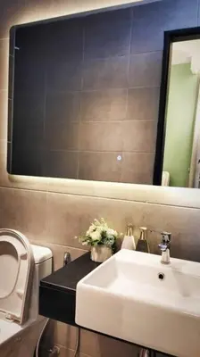 a bathroom with a sink and a mirror at Romantic Sea View @ Urban Suite in Jelutong