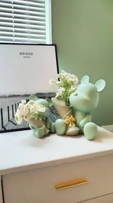 a desk with flowers and a laptop on it at Romantic Sea View @ Urban Suite in Jelutong