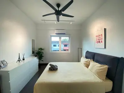 a bedroom with a bed and a ceiling fan at Modern Cozy House 4 ROOM 10pax@Bukit Mertajam in Bukit Mertajam