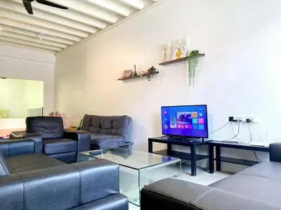 a living room with couches and a flat screen tv at Modern Cozy House 4 ROOM 10pax@Bukit Mertajam in Bukit Mertajam