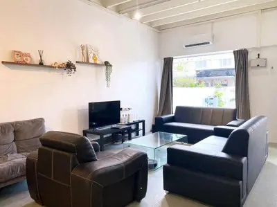 a living room with two couches and a tv at Modern Cozy House 4 ROOM 10pax@Bukit Mertajam in Bukit Mertajam