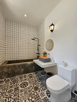 a bathroom with a toilet and a bath tub at Ipoh Young Villa - Hotel Inspired in Ipoh