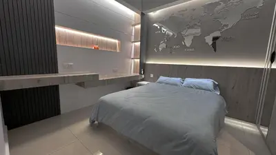 a bedroom with a bed with a map on the wall at Grand’e La Villa Homestay in Lumut