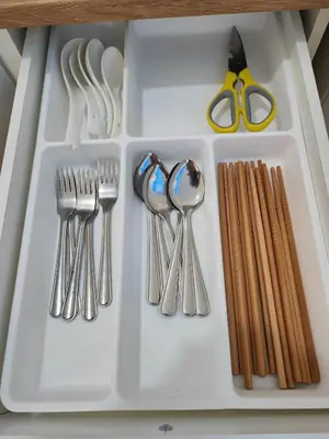 a white tray with utensils and a pair of scissors at Cozy Roomstay Padang Serai in Padang Serai