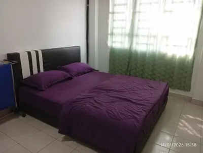 a purple bed in a bedroom with a window at Seberang Jaya Family Pool Homestay Near Hospital 3 Bedroom Aircond 2 Bathroom & Family Room Aircond in Perai