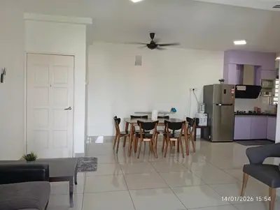 a living room with a table and chairs and a kitchen at Seberang Jaya Family Pool Homestay Near Hospital 3 Bedroom Aircond 2 Bathroom & Family Room Aircond in Perai